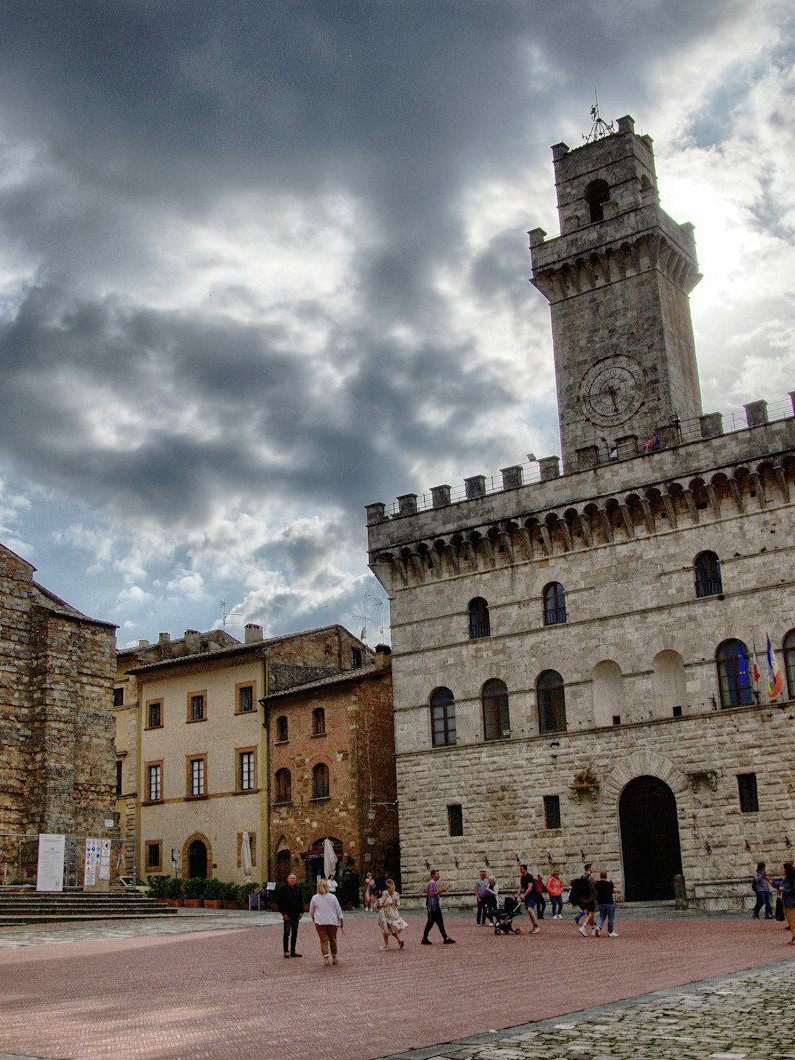 a group of people standing in front of a castle